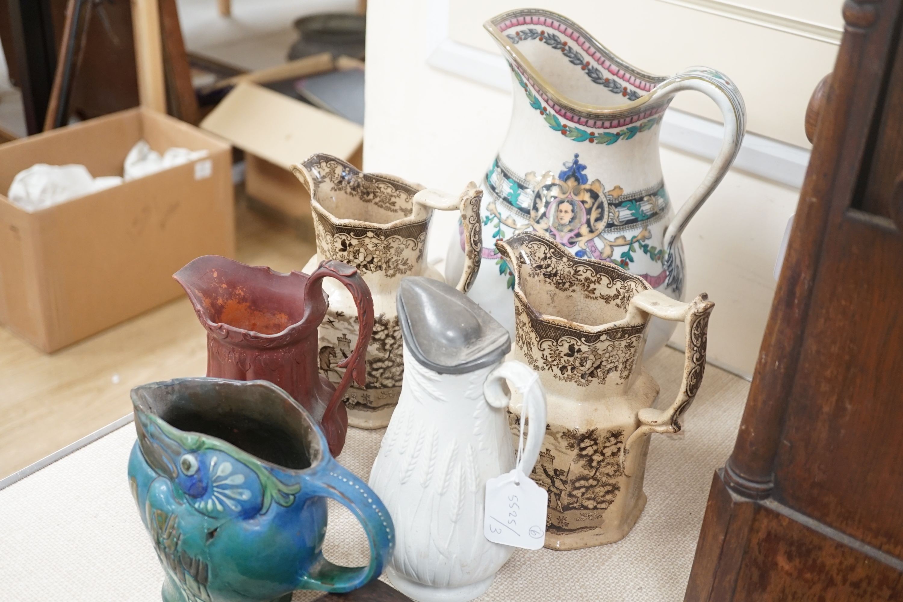 Six Victorian and later pottery jugs - tallest 29cm